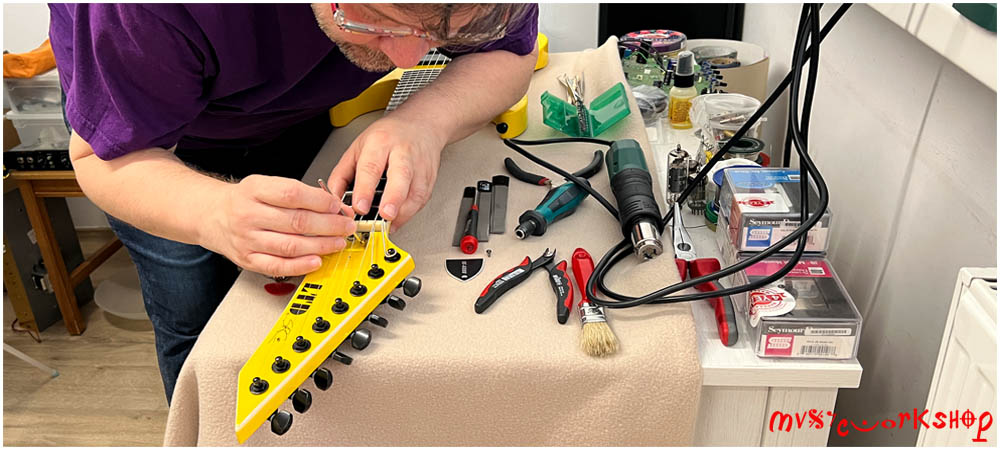 Setup premium pentru chitară electrică: lutierul reglează truss rod-ul pentru un instrument precis, confortabil și bine echilibrat.